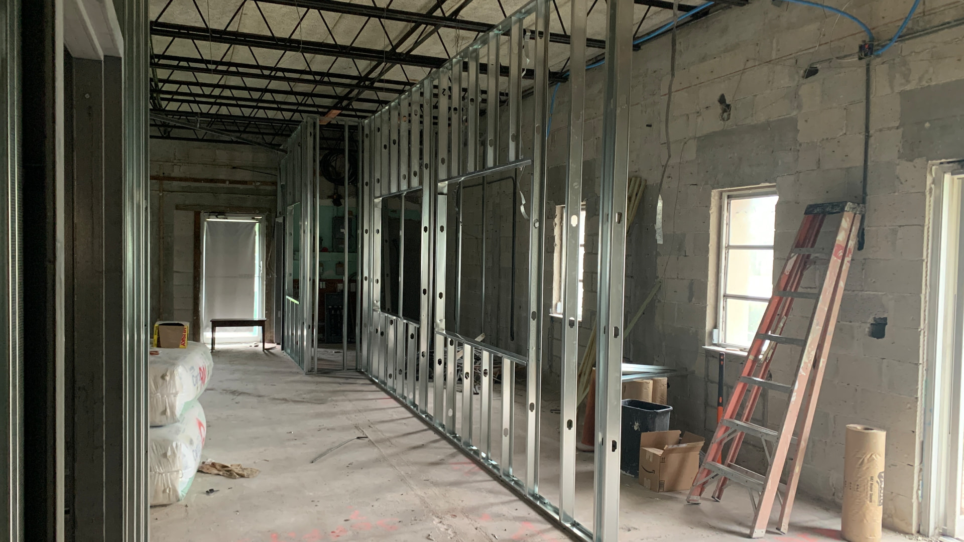 Corridor framing with electrical and plumbing rough-in